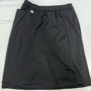Black midi SNOGA skirt with shorts under SNOGA ATHLETICS